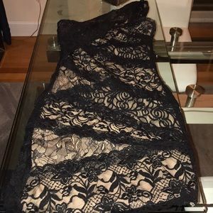 Bebe one shoulder black laced dress. Has bee worn.